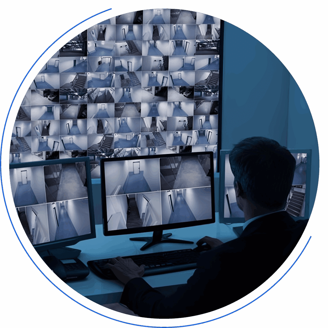 Man monitoring multiple security camera feeds.